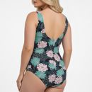 Floral patterned swimsuit on a model against a white background