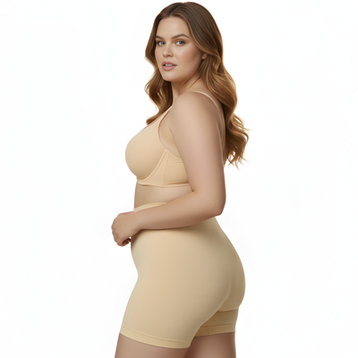 Woman wearing an Instantfigure beige shapewear garment on a white background
